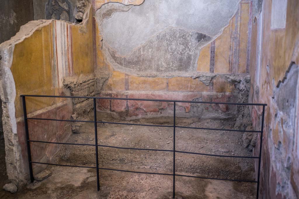 I.6.4 Pompeii. December 2021. 
Room 4, looking towards east wall, site of remains of impression of bed in the ash. Photo courtesy of Johannes Eber.
