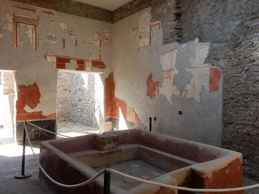 .6.7 Pompeii. May 2016. Looking across impluvium in atrium towards the south-west corner. The impluvium had been converted into a vat for fullery use. Photo courtesy of Buzz Ferebee.
