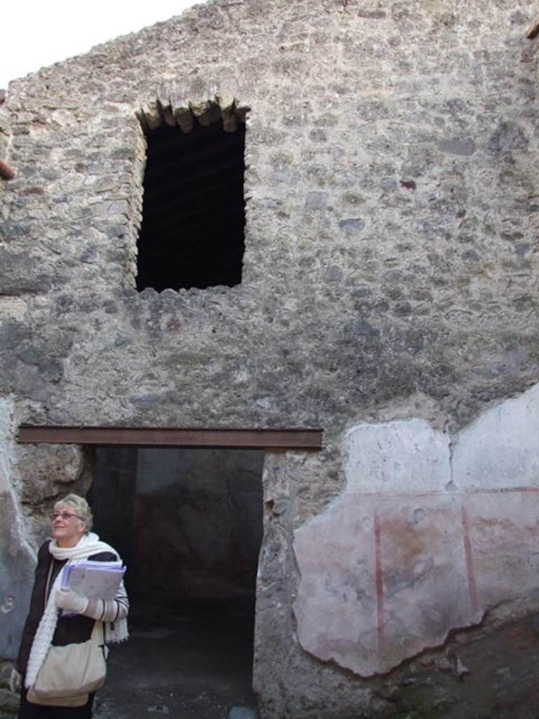 I.6.10 Pompeii. December 2007.  South wall with upper storey above door to rear room. 
