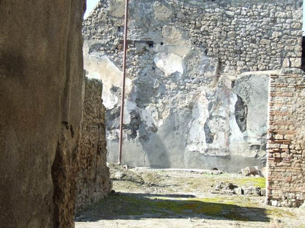 I.6.13 Pompeii. March 2009. Looking north through tablinum to remains of small garden area.
According to Jashemski 
The small garden at the rear of the house, which was undergoing extensive repairs at the time of the eruption, was originally outlined by a low masonry wall.
There were remnants of a garden painting on the rear wall, and a lararium niche in the east wall.
See Jashemski, W. F., 1993. The Gardens of Pompeii, Volume II: Appendices. New York: Caratzas. (p.36).

