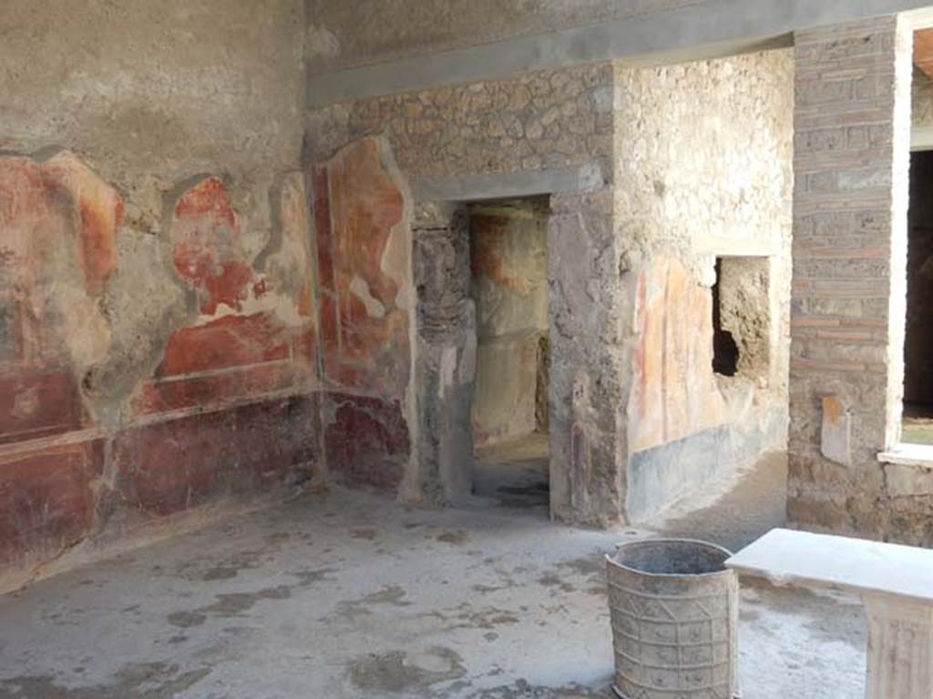 I.7.3 Pompeii. May 2016. South-east corner, and south wall of atrium. In the centre is a doorway to a cubiculum, on the right the doorway and window leads to the garden area. Photo courtesy of Buzz Ferebee.