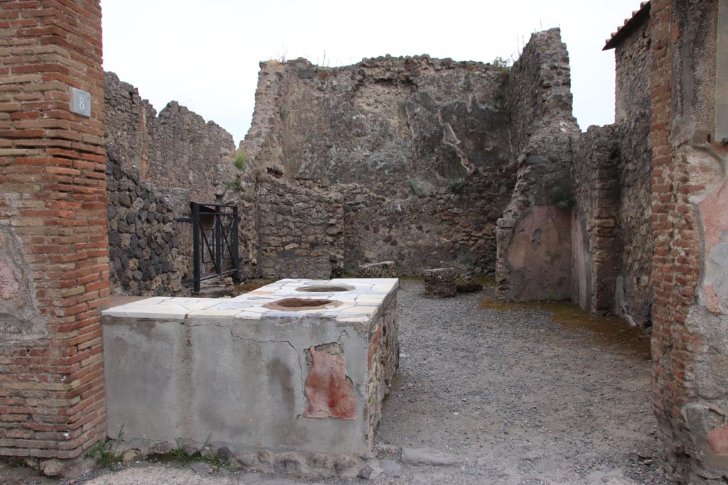 I.7.8 Pompeii. May 2024. Looking south through entrance doorway across bar-room. Photo courtesy of Klaus Heese.