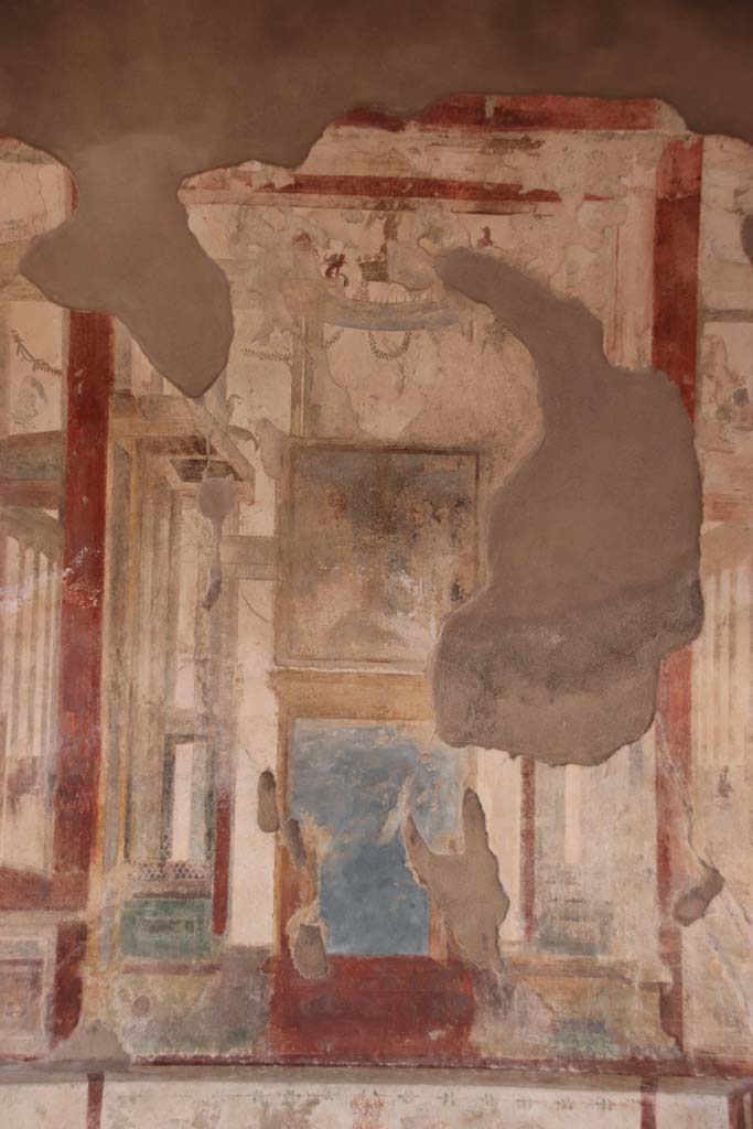 I.7.11 Pompeii. September 2021. Painted decoration in centre panel of north wall. Photo courtesy of Klaus Heese.
