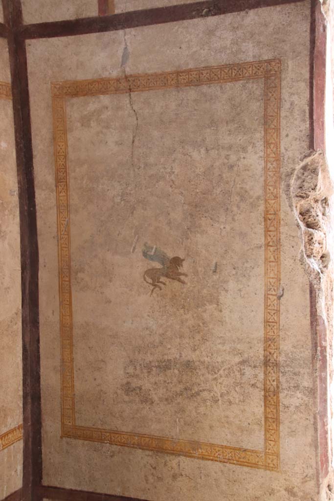 I.7.11 Pompeii. September 2021. West wall with painted panel. Photo courtesy of Klaus Heese.
