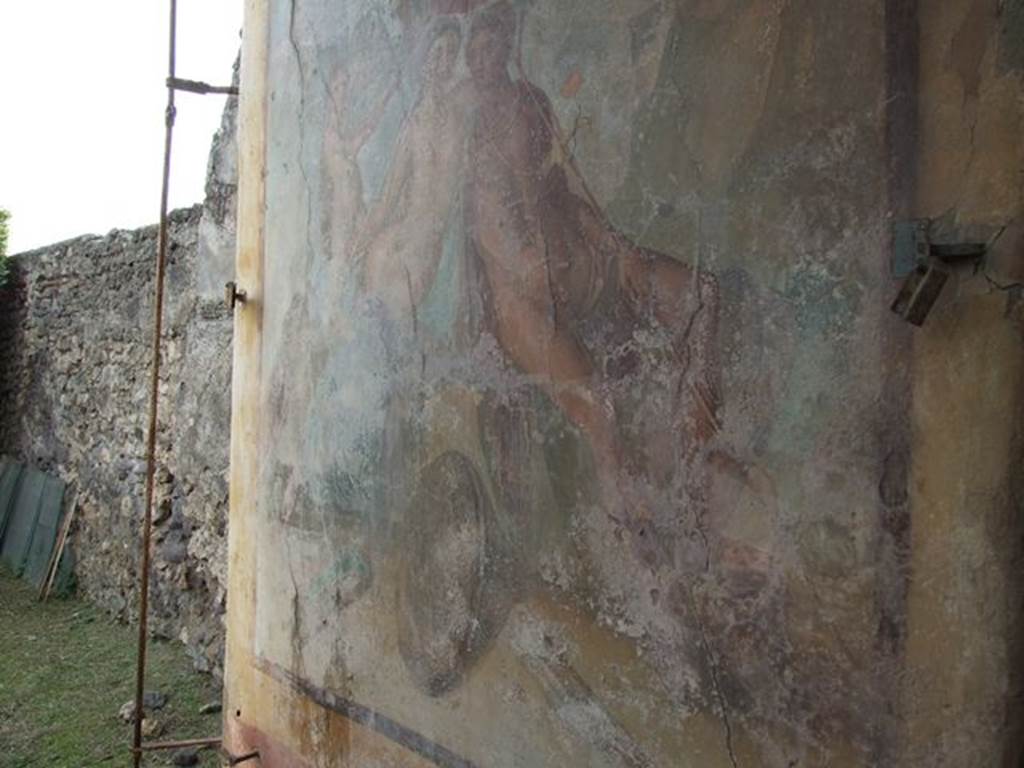 I.7.12 Pompeii. December 2006. Wall painting on west wall of water tower, opposite the entrance. According to Jashemski, “The large pillar at the west end of the lower part of the portico, camouflaged by a large painting of Mars and Venus, was actually a castellum aquae which had inserted in its top a reservoir (lined with good signinum) of a three-cubic-meter capacity. The water collected from the roof of the triclinium and the portico provided for the fountains, the elevation making possible the jets. The construction of the castellum aquae obstructed the view of the fine shrine, one of the best preserved at Pompeii”. See Jashemski, W. F., 1993. The Gardens of Pompeii, Volume II: Appendices. New York: Caratzas. (p.40)
