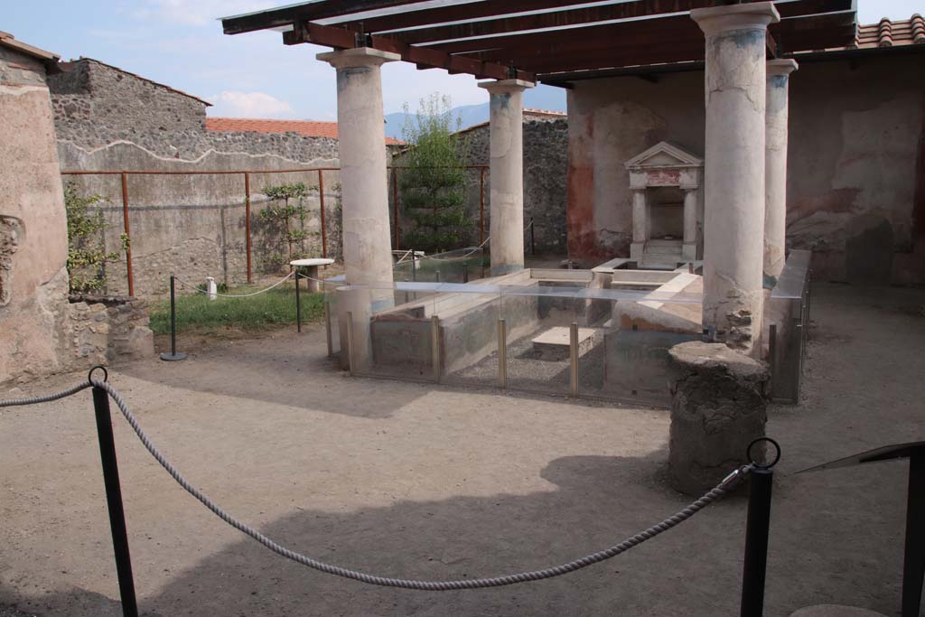 I.7.12 Pompeii. September 2021. Looking south-east across garden area with summer triclinium. Photo courtesy of Klaus Heese.