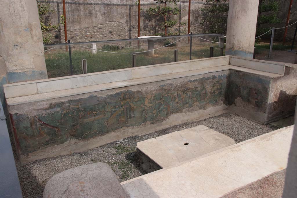 I.7.12 Pompeii. September 2021. Painted panel on inside of east and south sides of summer triclinium. Photo courtesy of Klaus Heese.