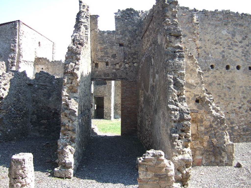 I.7.16 Pompeii. September 2005. Entrance doorway, leading into courtyard. Looking east. In the south-east corner of the courtyard was a summer triclinium. According to Della Corte, graffiti found on the walls of the courtyard gave the names of the scriptores   Astylus, Iarinus, Papilio and Tychicus  [CIL IV 7243, 7248, 7249 and 7251]
According to Epigraphik-Datenbank Clauss/Slaby (See www.manfredclauss.de), these read as -
L(ucio)  Ael(i)o  Magno 
feliciter  Astylus 
Iarine fellas         [CIL IV 7243]
Papilio  v(ir)  b(onus)       [CIL IV 7248a]
Astylus                [CIL IV 7248b]
Tychice  habeas  magnum  propitium       [CIL IV 7249]
L(ucium)  Ceium  Secundum  IIvir(um)  o(ro)  v(os)  f(aciatis)  d(ignum)  r(ei)  p(ublicae) 
Papilio                 [CIL IV 7251]

