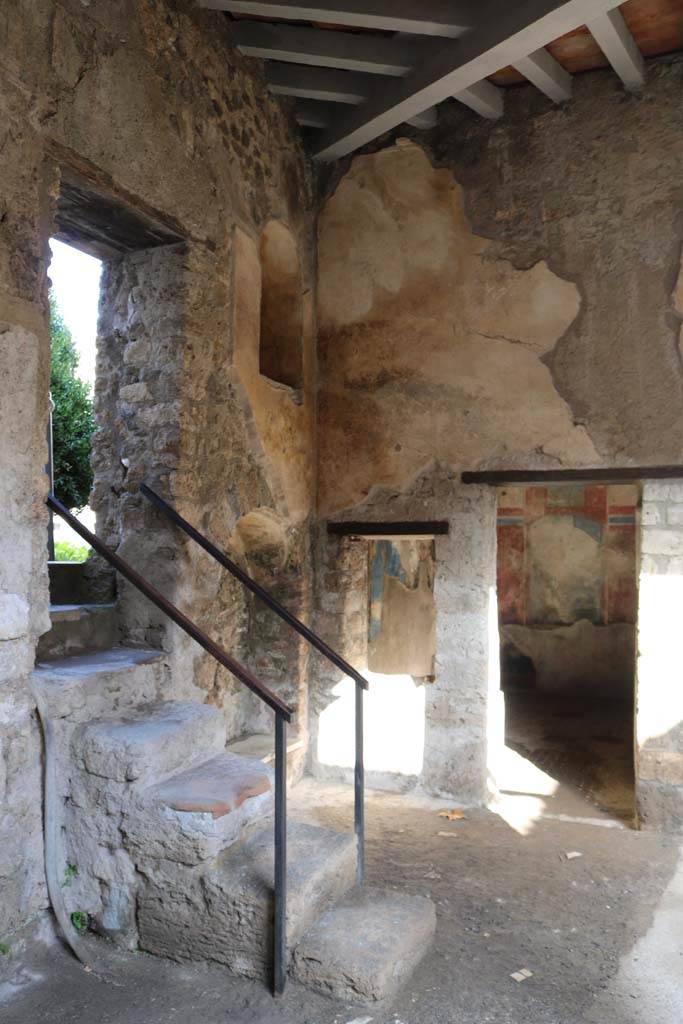 I.7.19 Pompeii. December 2018.
Looking towards steps up to garden of I.7.12, and doorway to cubiculum in north-east corner of the pseudoperistyle.
Photo courtesy of Aude Durand.