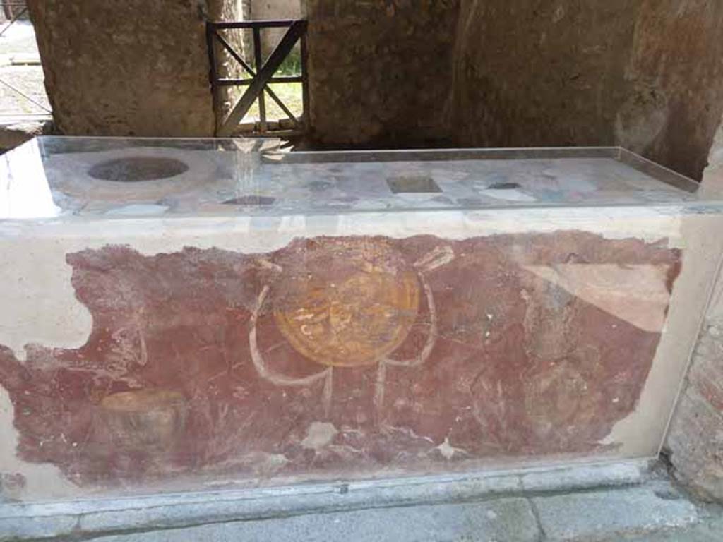 I.8.1 Pompeii. May 2010.  Painted decoration on counter front.