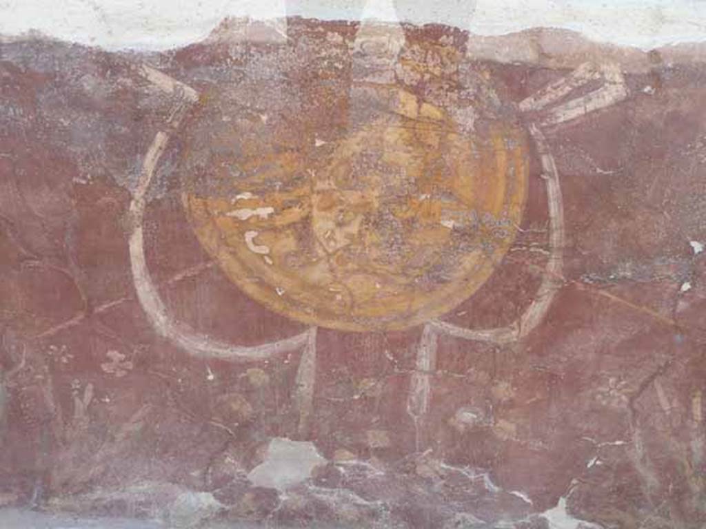 I.8.1 Pompeii. May 2010.  Painted decoration in centre of counter front.