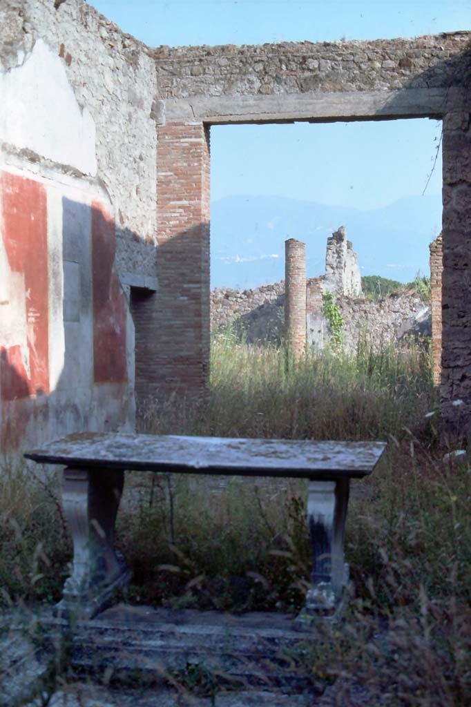 I.8.5 Pompeii. August 1976. Looking south-east across atrium towards east wall of tablinum.
Photo courtesy of Rick Bauer, from Dr George Fays slides collection.

