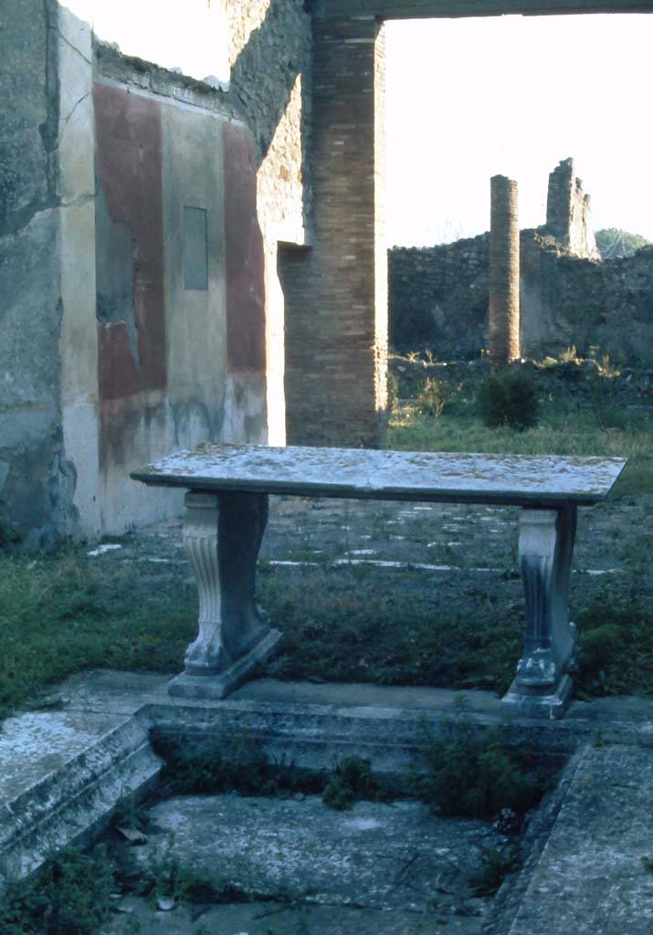 1.8.5 Pompeii. 4th December 1971. Looking across impluvium in atrium, towards east wall of tablinum.
Photo courtesy of Rick Bauer, from Dr.George Fays slides collection.
