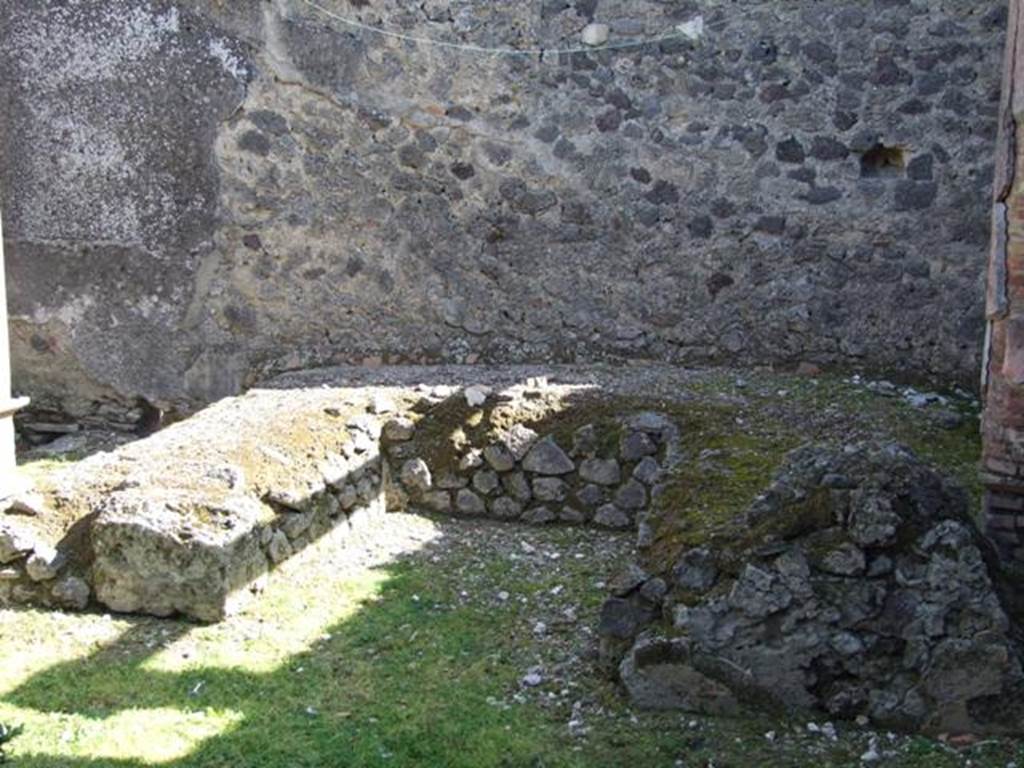 I.8.9 Pompeii.  March 2009. Room 9 and Garden area.  Triclinium against east wall.
