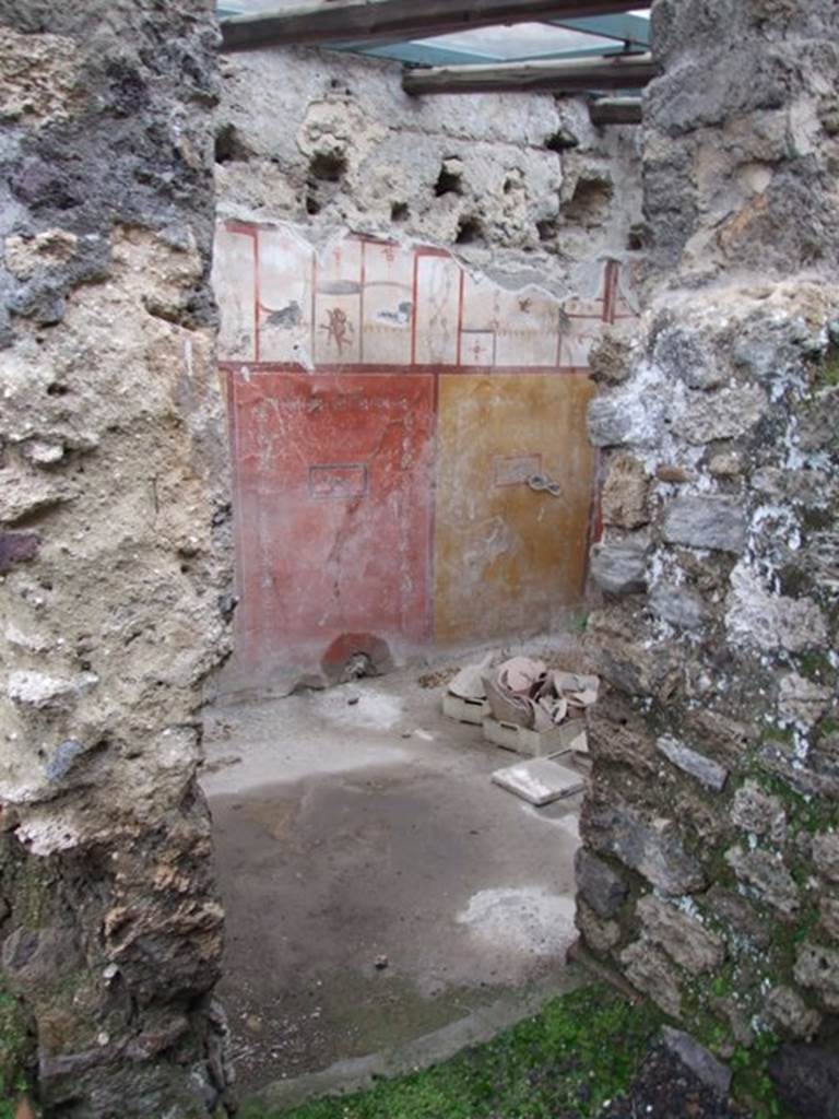 I.8.14 Pompeii. December 2007. Room 9, room in north-east corner.
The walls were painted in the Fourth style, in the middle zone with simple yellow and red panels with still-life paintings.
In the upper zone, painted white and divided into areas, were panels and paintings independent of the partitions of the area below.


