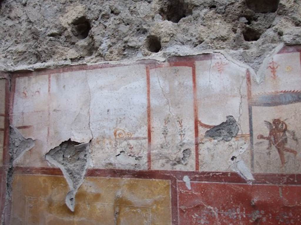 I.8.14 Pompeii. December 2007. Room 9, upper north wall at west end, with detail of painted plaster. 

