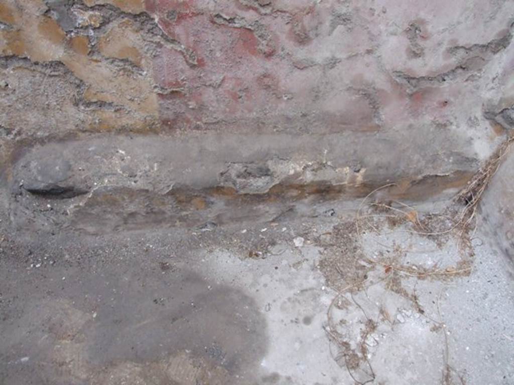 I.8.14 Pompeii. December 2007. Room 9, west wall with stone ledge feature in room.  