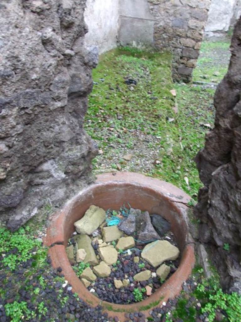 I.8.14 Pompeii. December 2007. Courtyard 7, looking through hole in wall to rear rooms of I.8.15/16.

