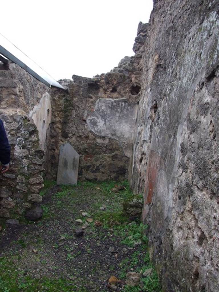 I.8.14 Pompeii. December 2007. Room 8, looking east.
From room (8), you enter the kitchen (10) to the north-west, with an adjoining latrine (11), and to the east into room 9, the only one that preserves more substantial remains of pictorial decoration of the IVth Style.
