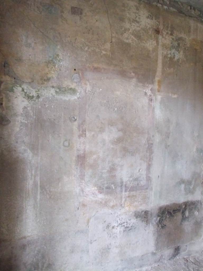 I.8.17 Pompeii. December 2007. Room 16, south wall, with remains of wall painting. According to Peters, this painting was in a similar frame to the one on the north wall, within this were remnants of a landscape scene.
The landscape surroundings could no longer be interpreted. See Peters, W.J.T. (1963): Landscape in Romano-Campanian Mural Paintings.The Netherland, Van Gorcum & Comp. (p.100)
