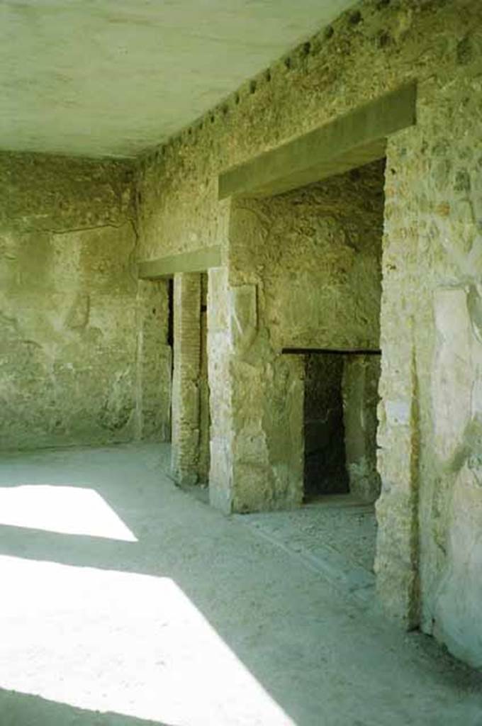 I.8.17 Pompeii. June 2010. Room 17, peristyle.
Looking south along west portico towards doorways of rooms 16, 11 and 18.
Photo courtesy of Rick Bauer.


