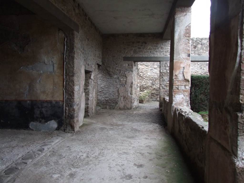 I.8.17 Pompeii. December 2007. 
Room 17, peristyle, looking north along west portico towards room 20. Room 18 is on the left.

