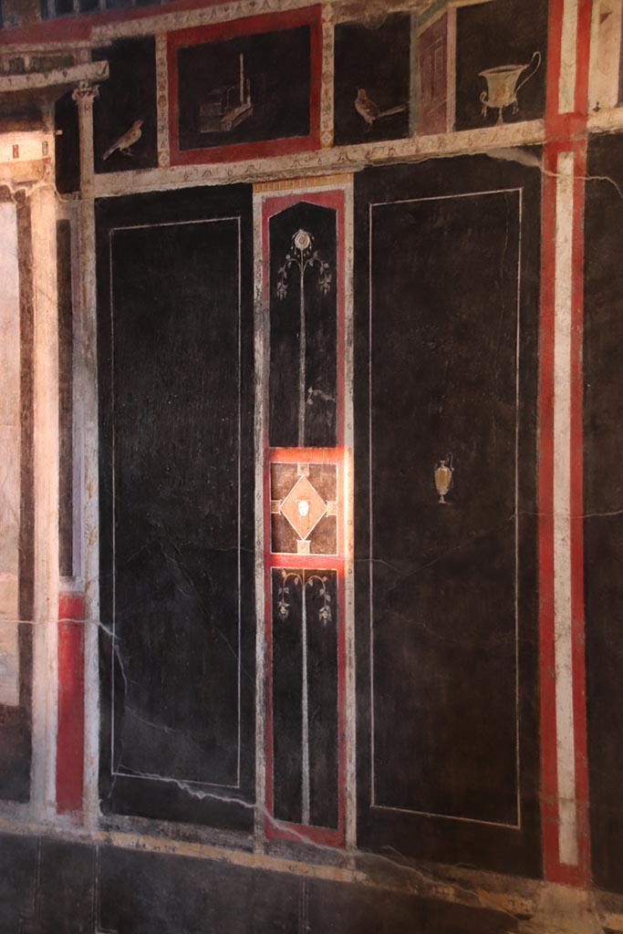 I.9.5 Pompeii. October 2024. 
Room 10, east wall on south side of central wall painting. Photo courtesy of Klaus Heese
