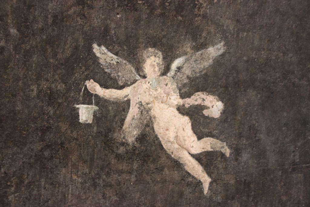 I.9.5 Pompeii. October 2023. Room 10, detail of flying figure from east wall at south end. Photo courtesy of Klaus Heese.