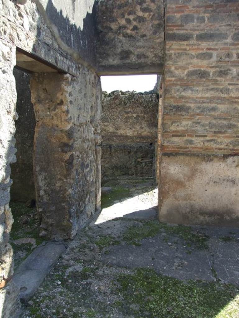 I.9.5 Pompeii. March 2009. Doorways to room 14 (left) and room 15 (ahead).