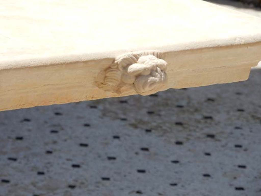 I.9.5 Pompeii, May 2018. Room 3, detail of feature on front of table near impluvium. Photo courtesy of Buzz Ferebee.