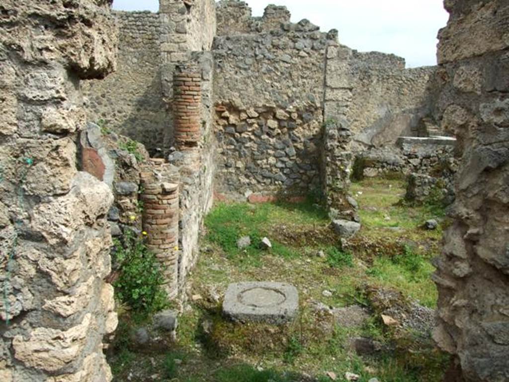 I.9.12 Pompeii. March 2009. Room 9. Looking east into room with remains of walls, bricked in columns and cistern, eventually leading to the bar at I.9.11