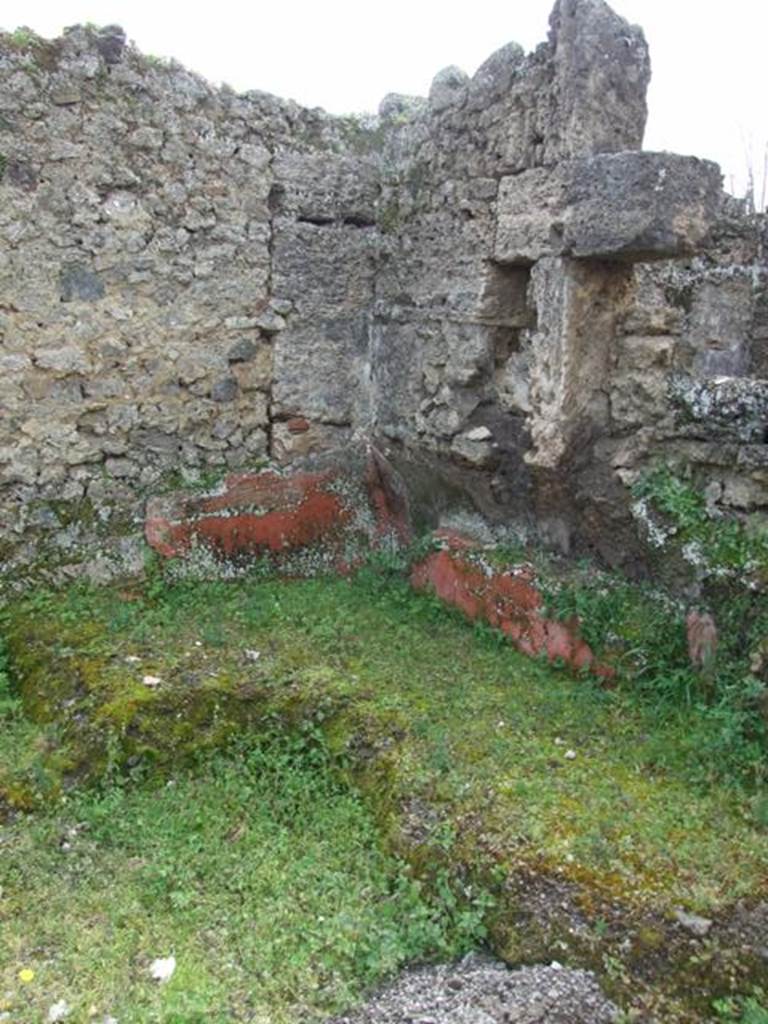 I.9.12 Pompeii. March 2009. Room 9. Remains of Triclinium in south west corner of room.