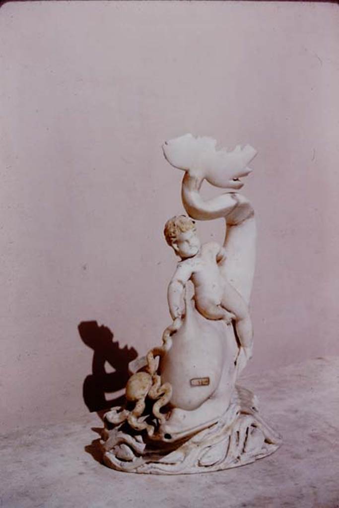 I.9.14 Pompeii. 1966. Marble amorino on dolphin with octopus. Photo by Stanley A. Jashemski.
Source: The Wilhelmina and Stanley A. Jashemski archive in the University of Maryland Library, Special Collections (See collection page) and made available under the Creative Commons Attribution-Non Commercial License v.4. See Licence and use details.
J66f0740