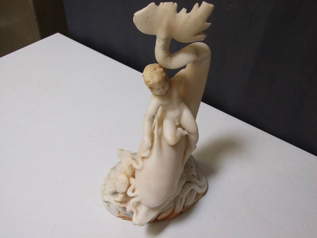 I.9.14 Pompeii. Marble fountain statuette. Amorino on dolphin with octopus. SAP inventory number 8126. Found in 1951.