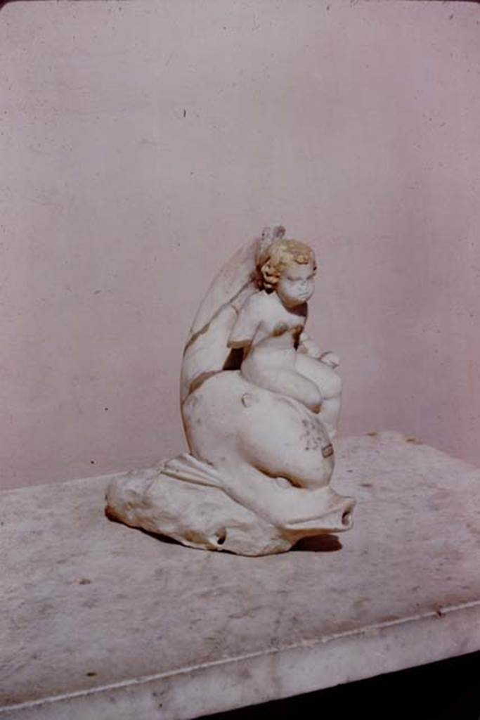 I.9.14 Pompeii. 1966. Cupid with basket on arm riding on dolphin. Photo by Stanley A. Jashemski.
Source: The Wilhelmina and Stanley A. Jashemski archive in the University of Maryland Library, Special Collections (See collection page) and made available under the Creative Commons Attribution-Non Commercial License v.4. See Licence and use details.
J66f0739