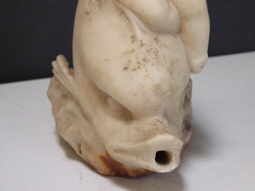 I.9.14 Pompeii. Marble fountain statuette. Amorino with basket on arm riding on dolphin. Dolphin. SAP inventory number 8127. Found in 1951.