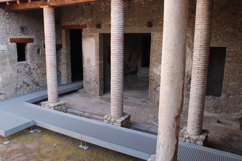 I.9.14 Pompeii. October 2022. 
Room 2, lower garden area at south end. Looking south-east to rear of house. Photo courtesy of Klaus Heese.
