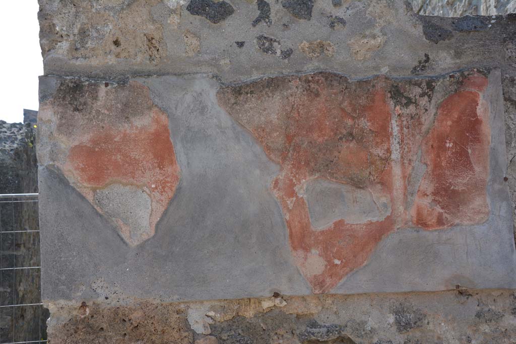 I.10.3 Pompeii. April 2017. Painted plaster on west side of entrance. Photo courtesy Adrian Hielscher.