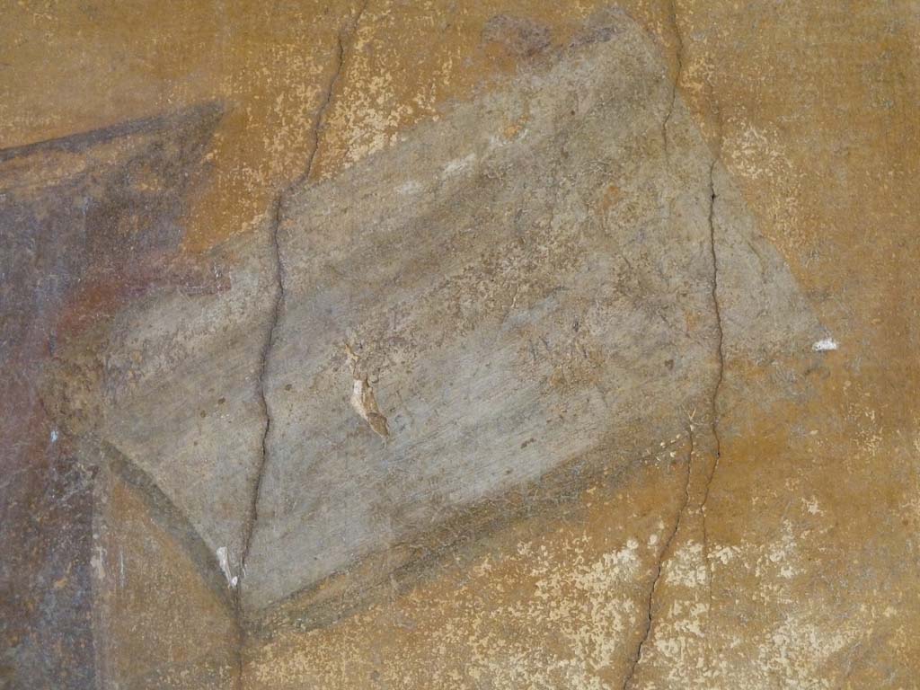 I.10.4 Pompeii. May 2010. Alcove 23, detail from Menander’s open paper scroll held in his hand.
According to Varone this used to read, in small black letters, the words 

Menander
Hic primu[m] om[niu]m como
ediam scripsit
qu[i] E[rat] anno
ru[m] XIV  
Lib[ri] IIII

According to Varone, this refers to the fact that Menander wrote his first comedy at the age of 14. Four books.

Della Corte read XIX instead of XIV, see CIL IV 7350b.
According to Cooley this translated to “Menander. He was the first of all to write comedy………four books”.

See Cooley, A. and M.G.L., 2004. Pompeii: A Sourcebook. London: Routledge. (p.70).
See Varone, A, 2003: Gli abitanti della casa, in Menander, La Casa del Menandro di Pompei. Edited by G. Stefani. Milan: Electa. (p. 46-55). 
