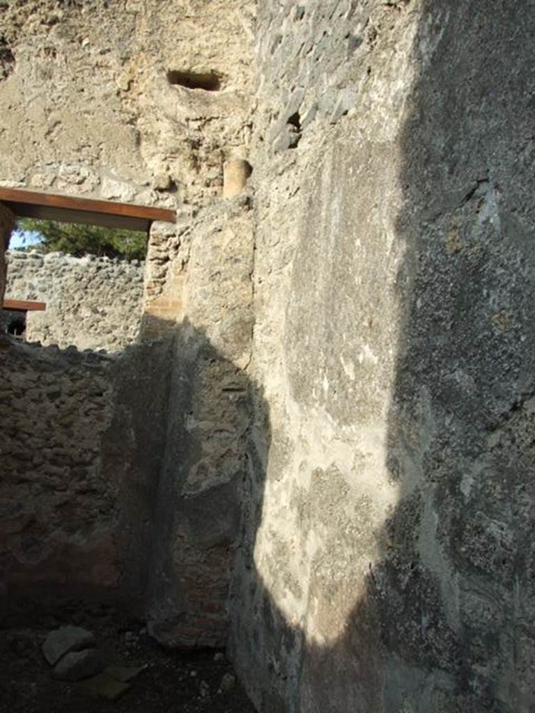I.10.6 Pompeii.  Workshop.   December 2007. Small room to east of workshop.  East wall, with waste pipe from upper level.