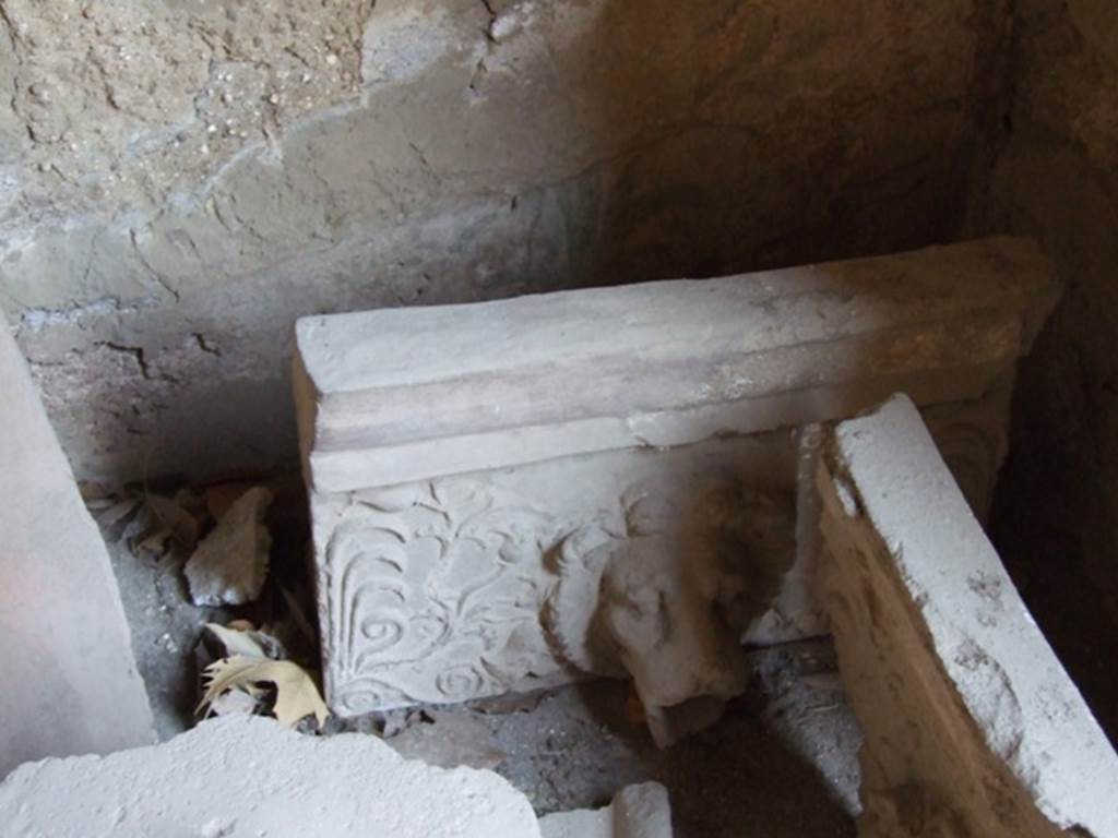 I.10.7 Pompeii. March 2009.  Room 3.   Cubiculum.  Remains of a Lion.  Grondaia or antefisse fittili  (rainwater spouts for gutters).