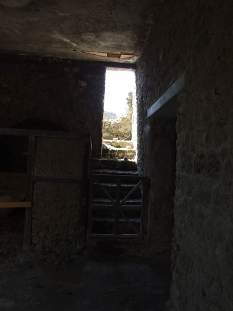 I.10.7 Pompeii. March 2009. Room 11, kitchen. Looking west towards stairs to upper floor.
According to NdS  
this brick stairs led up by 7 steps to another set of 7 steps which led to a terrace, and perhaps to the upper rooms.
See Notizie degli Scavi, 1934, (p.280.)


 
