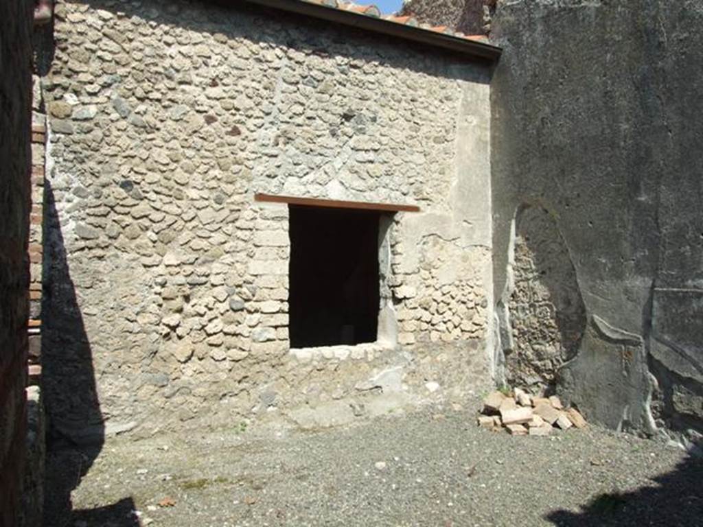 I.10.8 Pompeii. March 2009. Room 4, north wall of workroom, and window to room 3.
