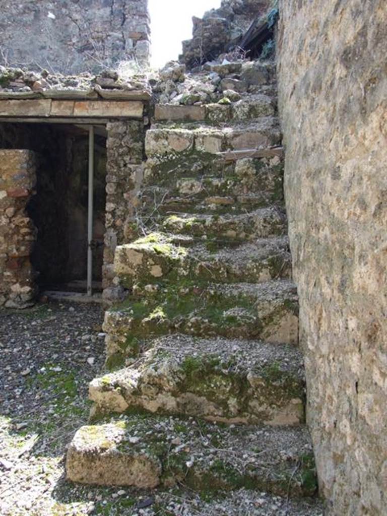 I.10.8 Pompeii. March 2009. Room 5, stairs to upper gallery against west wall of the yard.