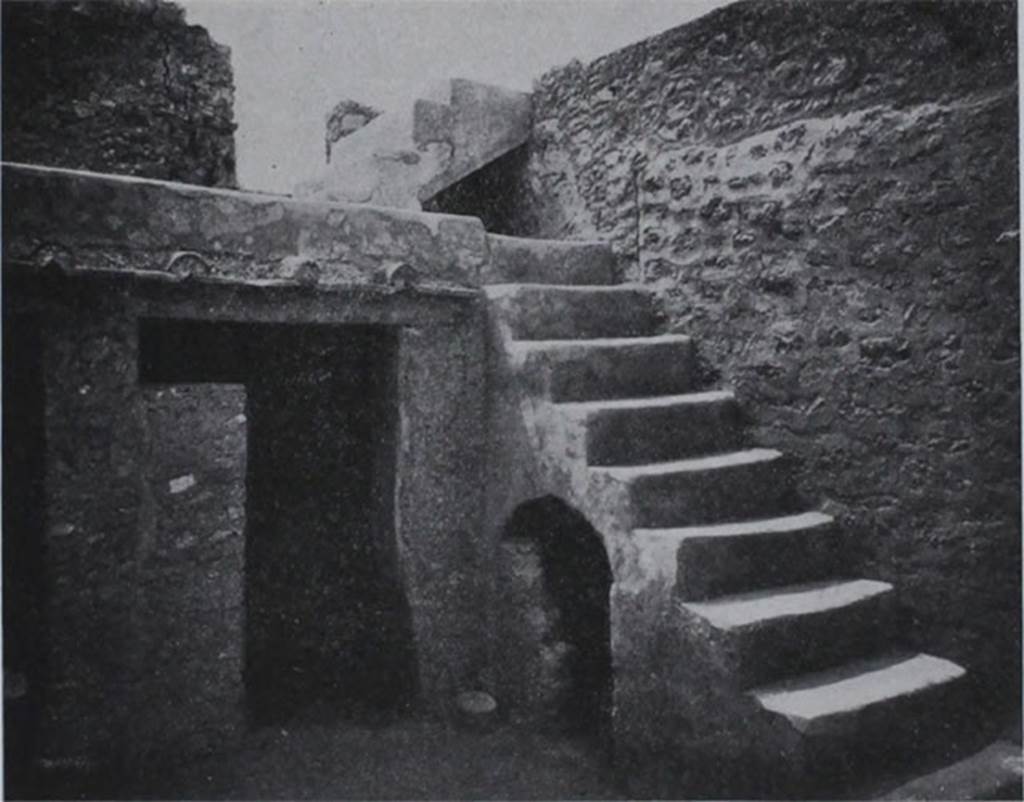 I.10.8 Pompeii. Room 5, south-west corner of the yard, with stairs to upper gallery and cupboard under, and doorway to small room.
These masonry steps against the west wall, were covered with a coating of cocciopesto, and consisted of 9 steps leading to a gallery on which opened a room on the upper floor to the east.  From this then, by another four steps, one arrived at the western rooms of the upper floor.

Al lato occidentale una scalinata di fabbrica, rivestita di intonaco di cocciopesto, di nove gradini che porta ad un ballatoio, sul quale si apre un ambiente del piano superiore ad est.  Da questo poi per altri quattro scalini, si accede al quartierino ovest del piano superiore.

See Notizie degli Scavi di Antichit, 1934, p. 311, fig. 24.
