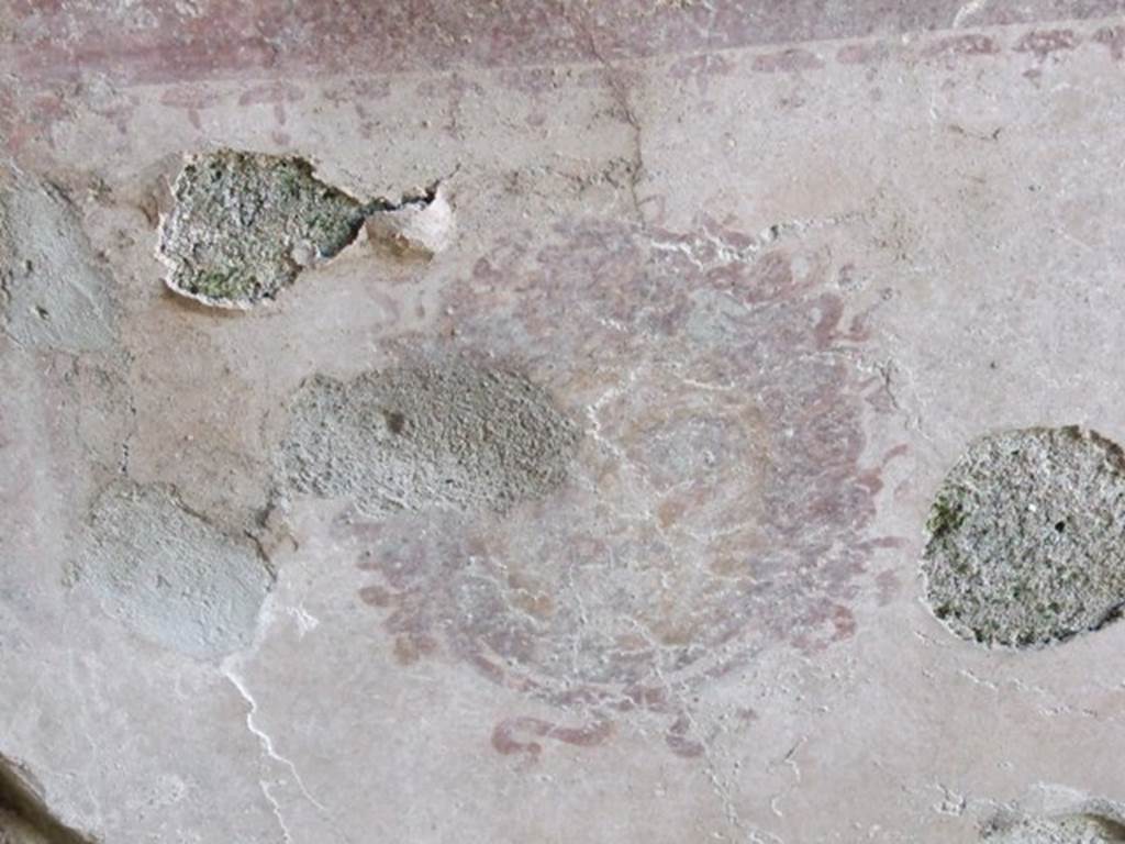 I.10.8 Pompeii. March 2009. Room 8, west wall of tablinum.  Remains of a painting of a Gorgon from the centre of the lower section. 
