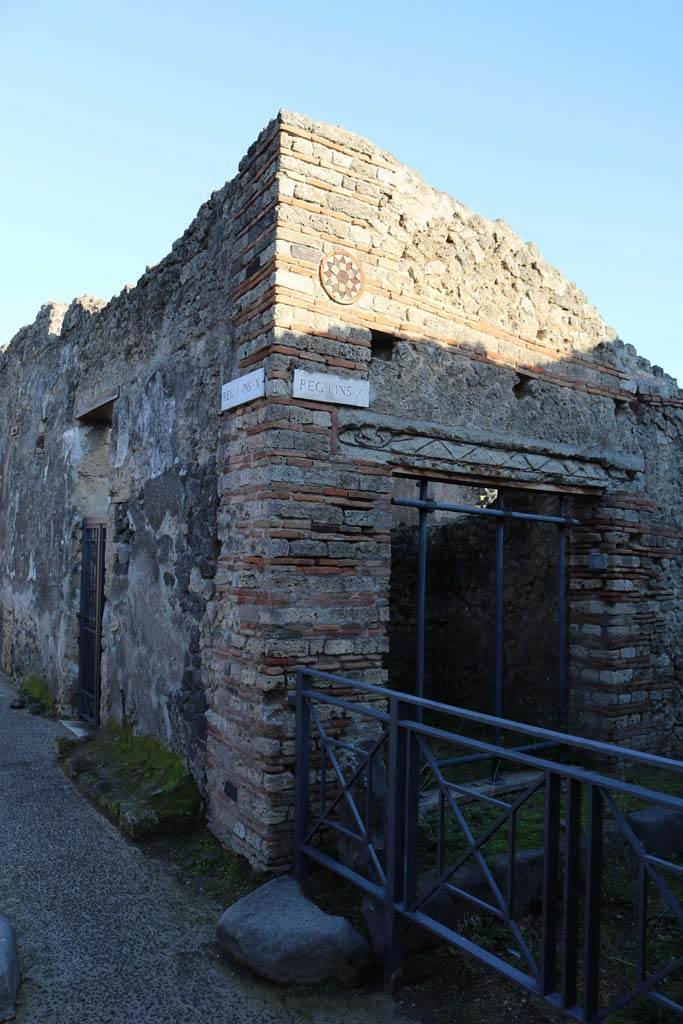 I.10.8, on left, and I.10.9, on right, Pompeii. December 2018. 
Looking towards east corner at junction with Vicolo del Menandro. Photo courtesy of Aude Durand.
