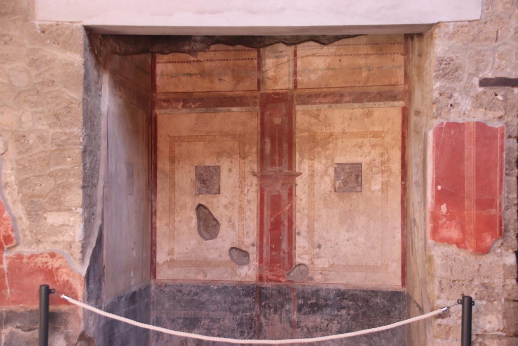 I.10.11 Pompeii. October 2022. Room 6, ala or exedra, looking towards upper south wall. Photo courtesy of Klaus Heese. 

