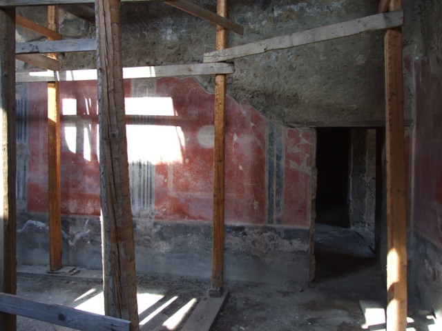 I.10.11 Pompeii. March 2009. Room 2, north wall of atrium, with doorway to triclinium room 8 in north-east corner, on right.