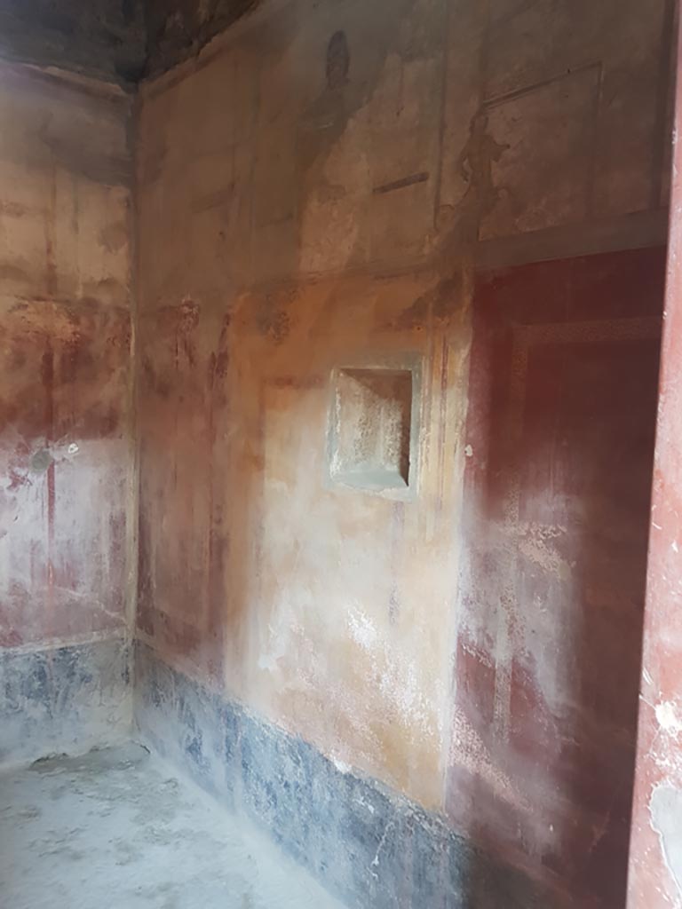 I.10.11 Pompeii. October 2022. 
Room 9, looking west along north wall from entrance doorway. Photo courtesy of Klaus Heese. 
